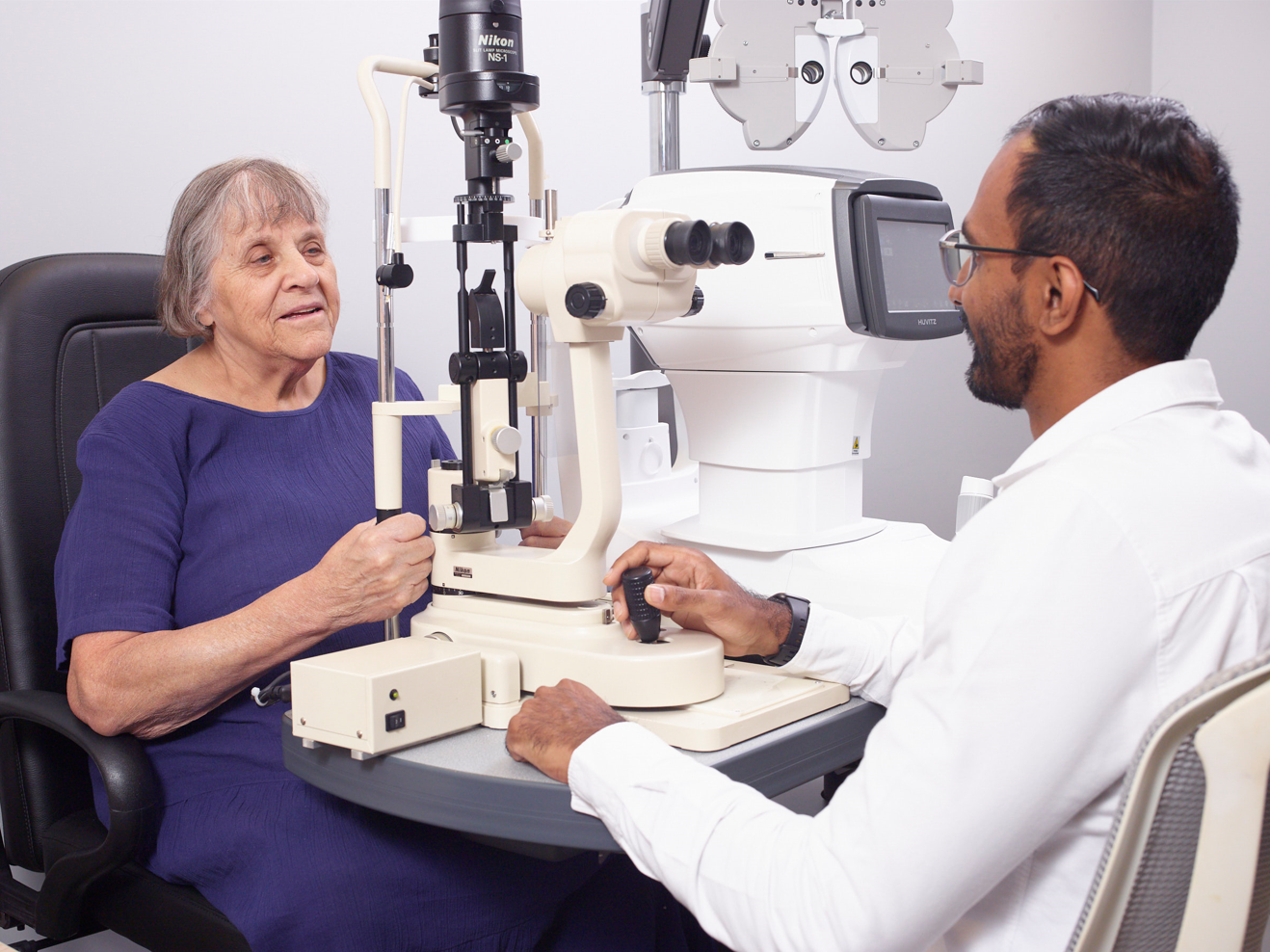 Patient looking into the eye machine.