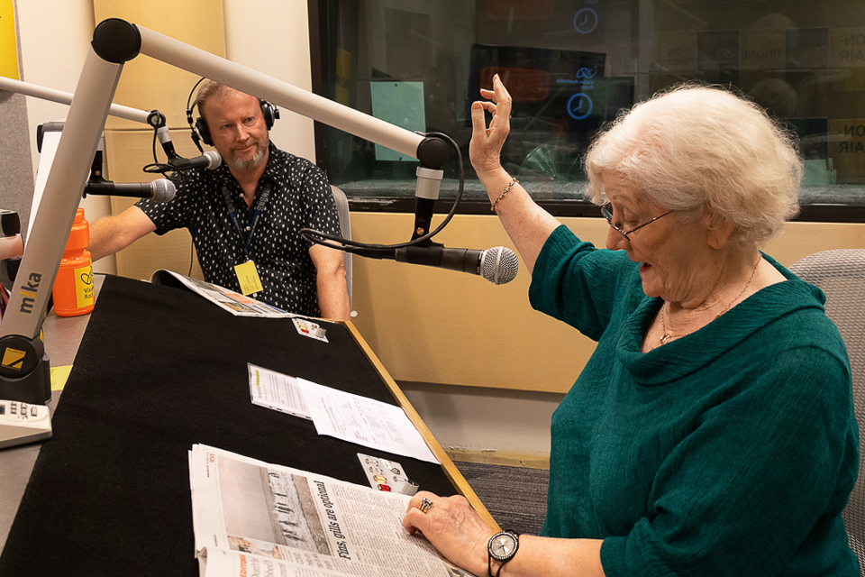 2 radio presenters in the Vision Australia Radio studio