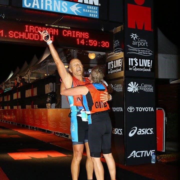 "An elated Mick being embraced at the end of the Cairns Ironman competition.   "