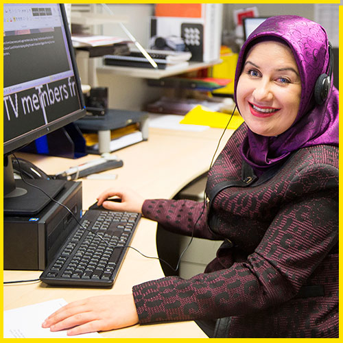 Neshilan at her desk using screen magnification software