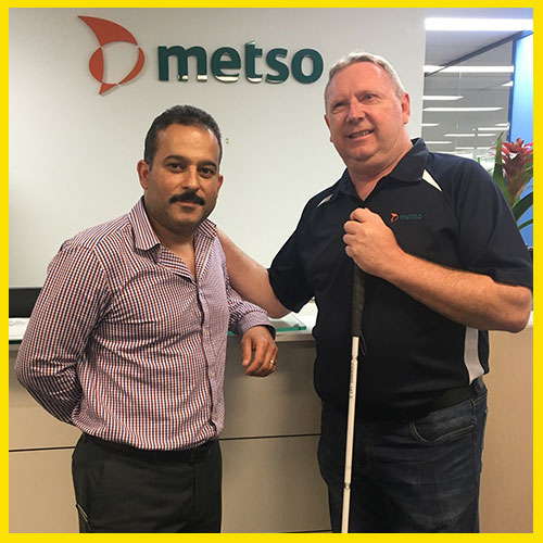 Paul and his boss standing in front of workplace reception desk