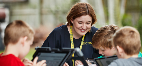 VA staff helping child clients with technology