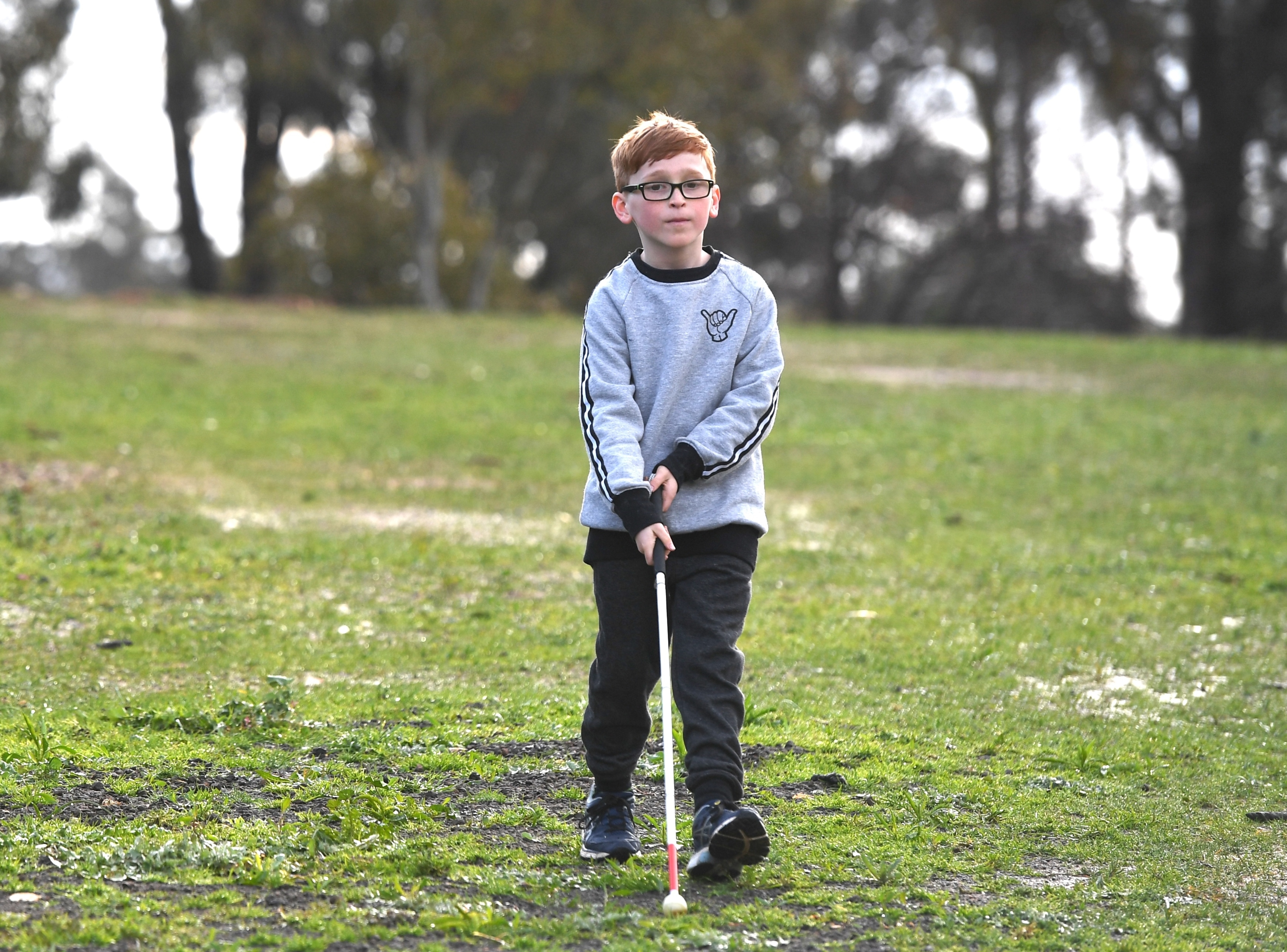 Zavier walking with a cane