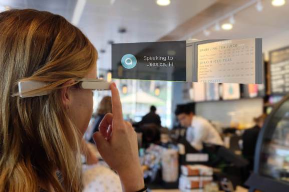 A woman uses a set of Aira glasses