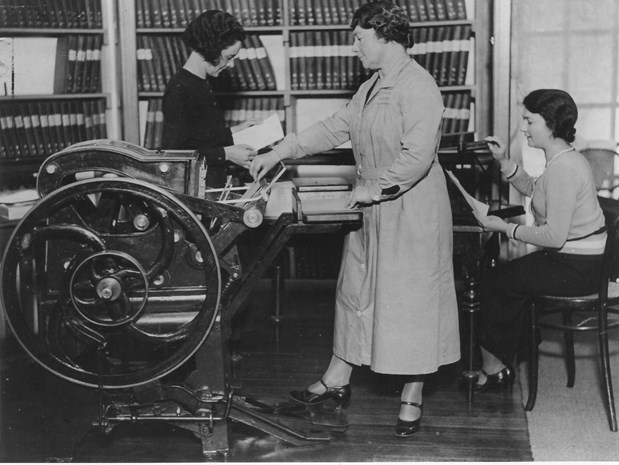 the Royal Victorian Institute for the Blind's Chief Librarian in 1934, Minne Crabb, using a the Crabb-Hulme printing press.
