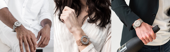 "Three people wearing different colours of the Eone watch, two in silver, one in rose gold colour."