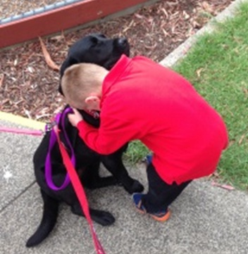 Faith 3 Student gives Faith the labrador a big hug