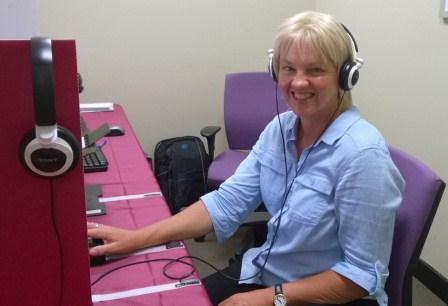 Vision Australia client Susan McAlister prepares to vote with e-Assist Vision Australia client Susan McAlister sitting infront of computer, preparing to vote with e-Assist