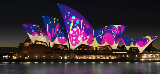 Image of Sydney Opera House with coloured lights on sails