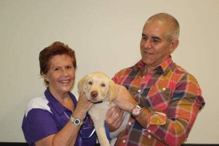 Dusty with Robi and Stephen Dusty with puppy carer Robi and Stephen Pitt from Lyncor