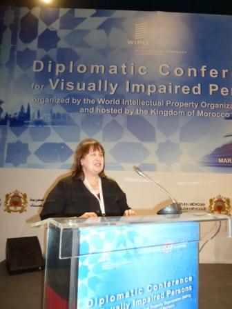 Maryanne Diamond presents at the WIPO conference in Morocco Maryanne Diamond speaking behind a lectern on stage at the conference