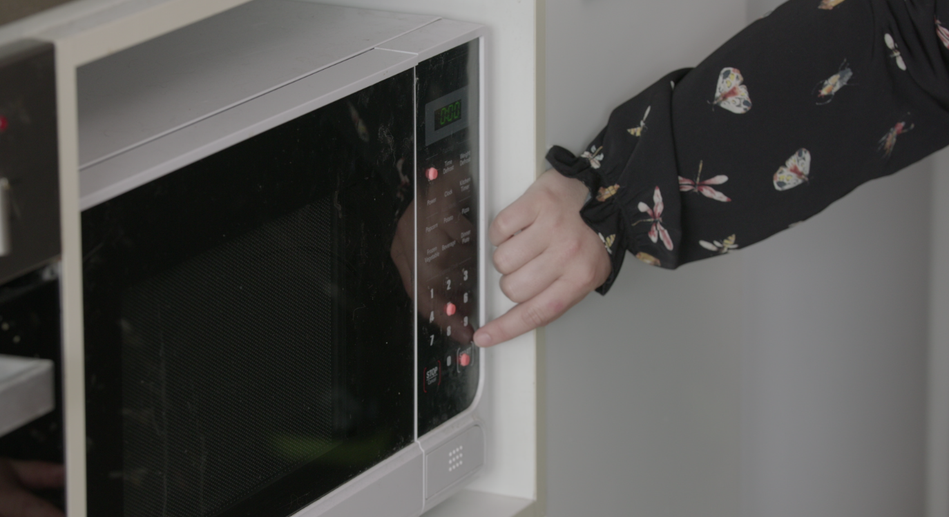 Dots on a microwave to indicate settings