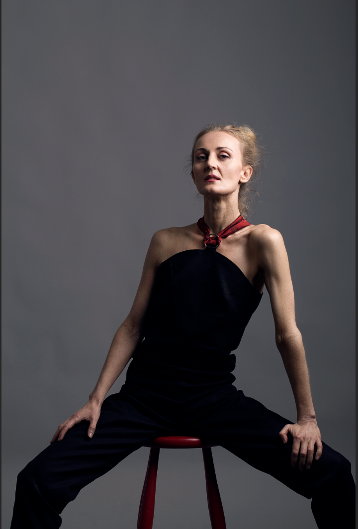 Nikki Hind in a black Blind Grit jumpsuit