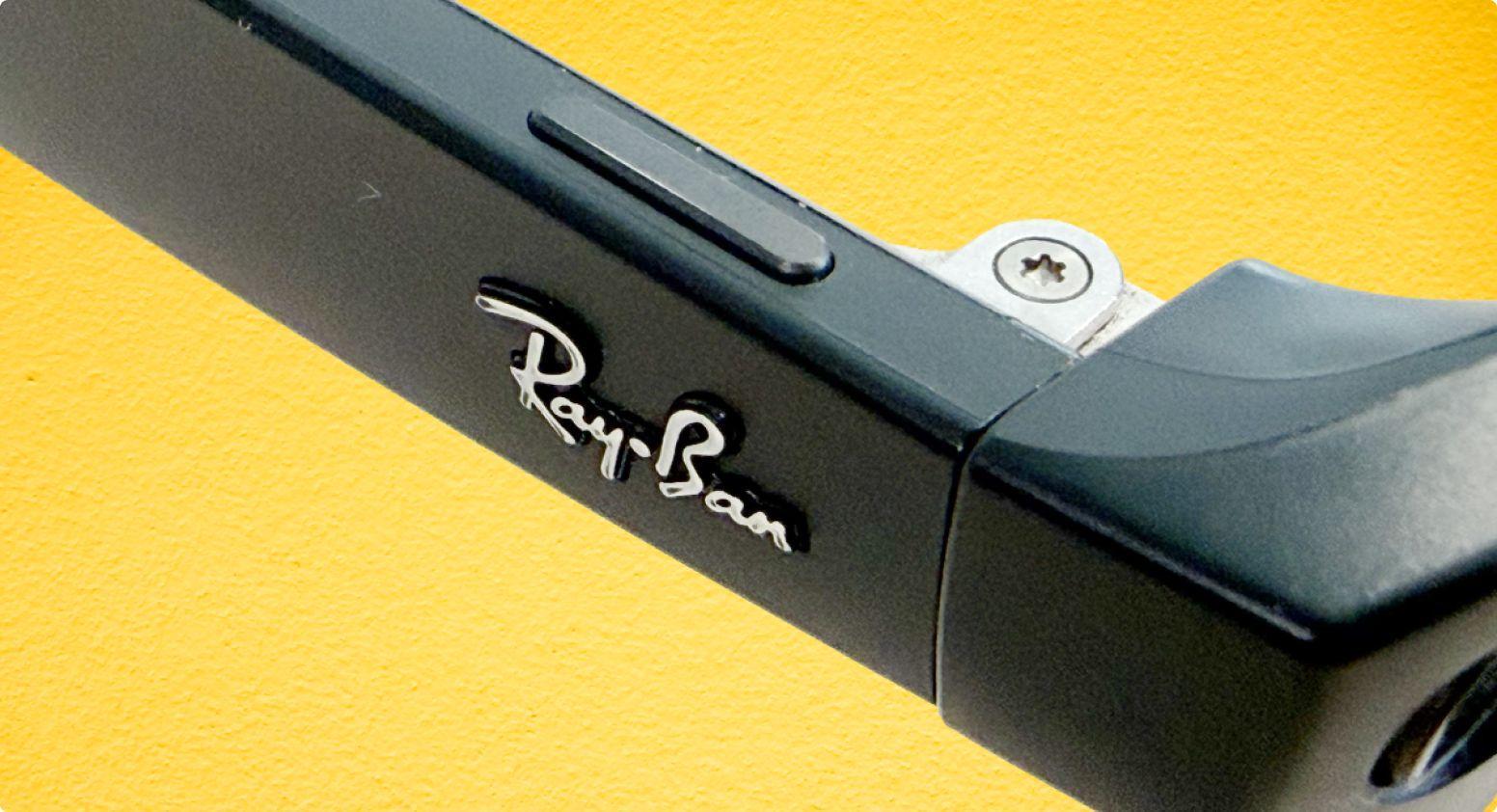 The right outside temple of the Ray-Ban Meta glasses where a long thin button is located on top of the glasses.